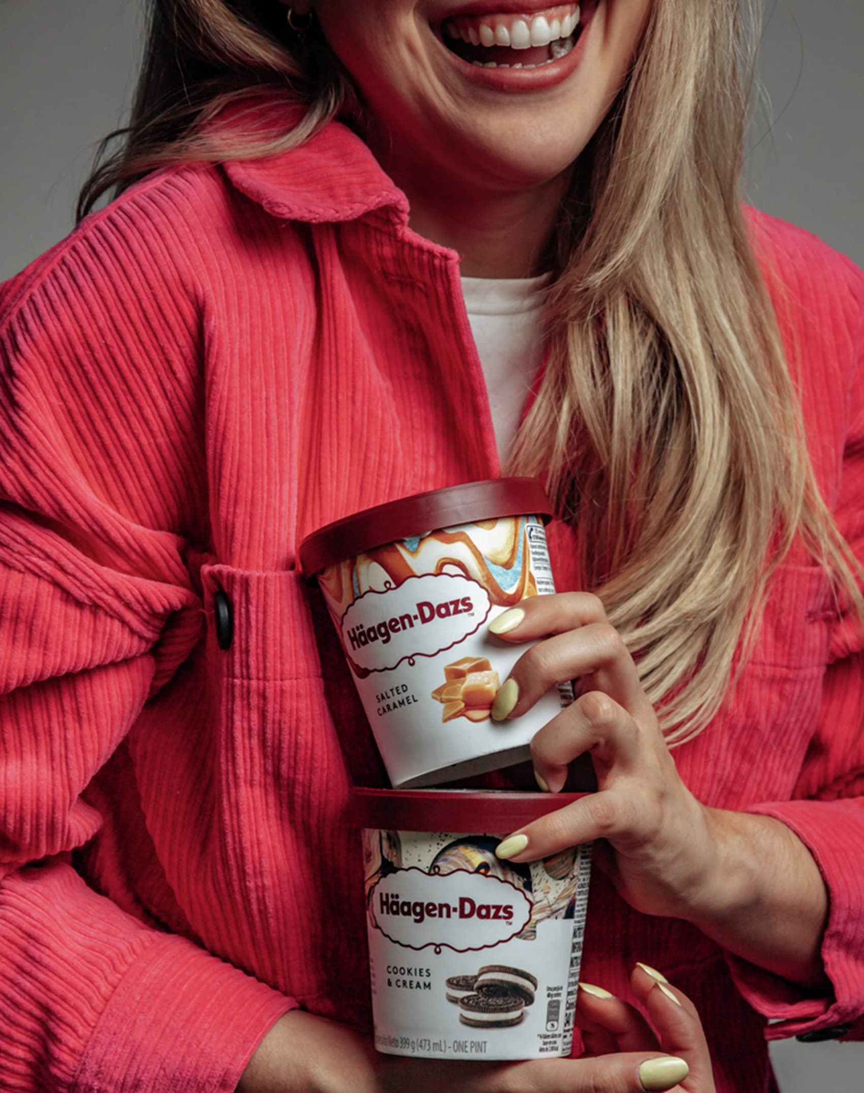 woman-having-haagen-dazs-pints-in-her-hand